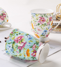Load image into Gallery viewer, Turquoise mug with flowers