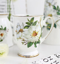 Load image into Gallery viewer, Mug with white flowers
